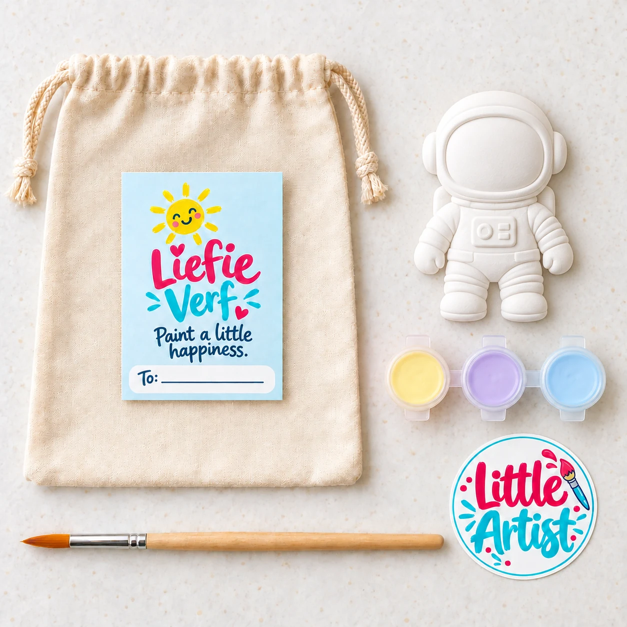 Astronaut paint-your-own party bag with plaster figure, three paint pots, brush, sticker and drawstring bag